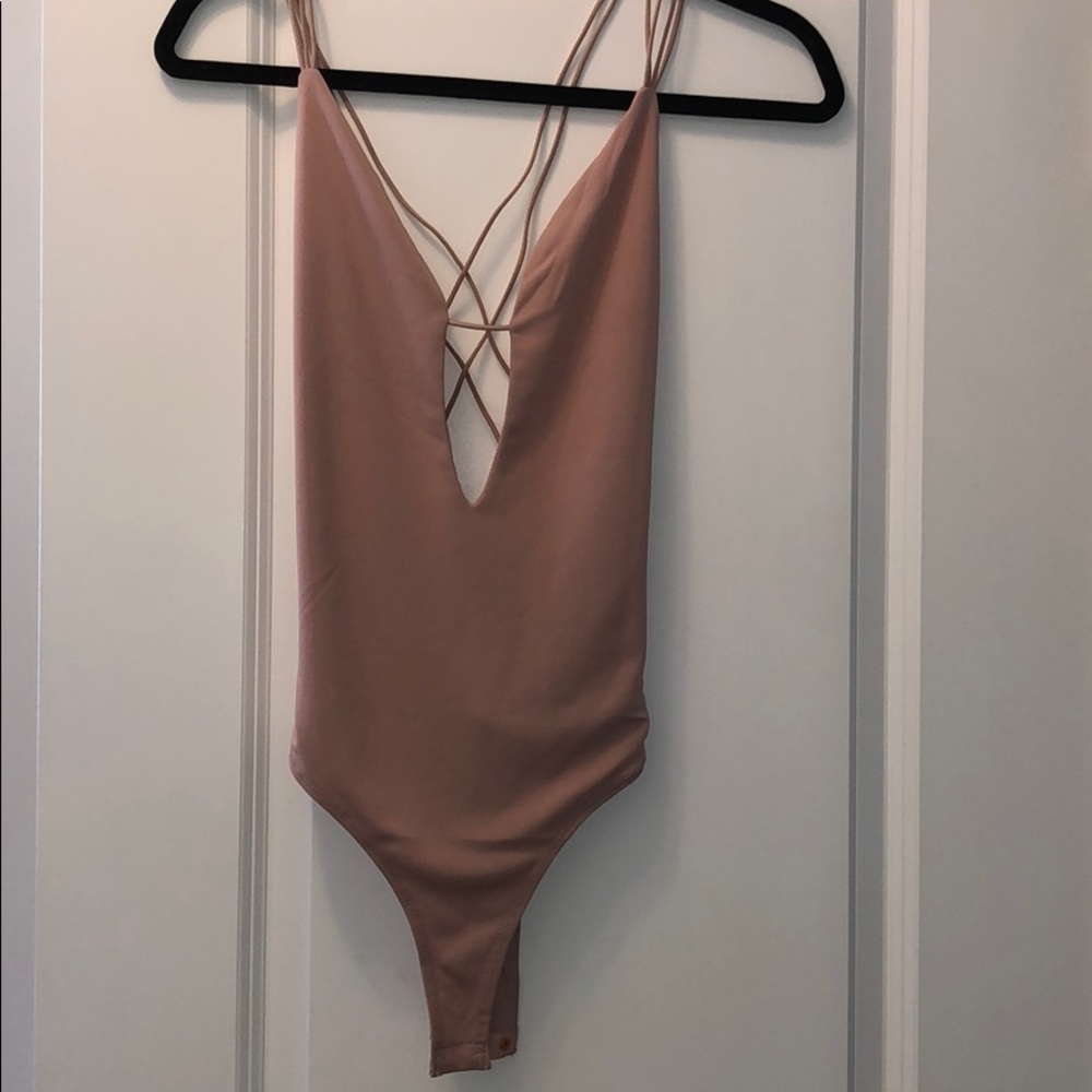 Baby pink body suit